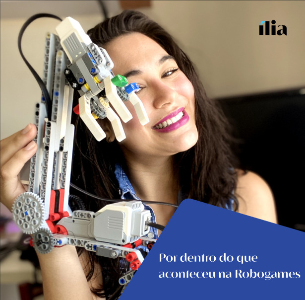 Na foto, Thamires de Pontes, nossa Java Backend Developer na ília, segura com orgulho a Ada, o robô que ela e sua equipe construíram para o Robogames 2023
